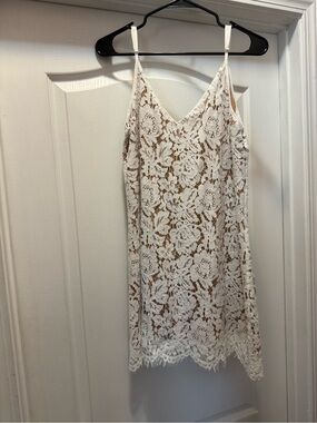 Lacy lined white mini dress